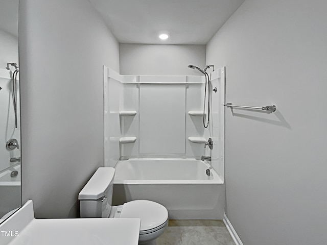 bathroom featuring toilet and washtub / shower combination