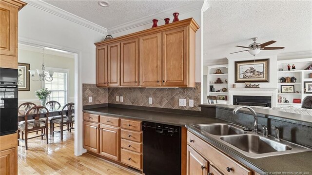 kitchen with light hardwood / wood-style flooring, crown molding, sink, black appliances, and a textured ceiling