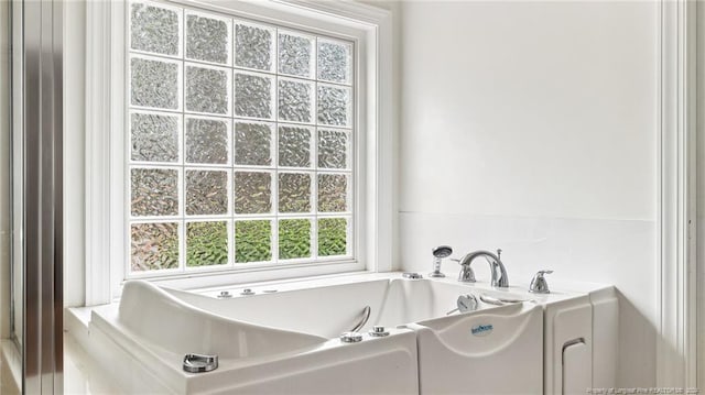 bathroom with a washtub