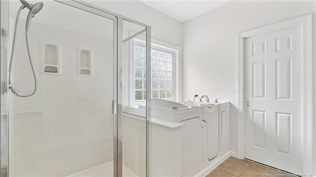 bathroom with tile patterned floors and plus walk in shower