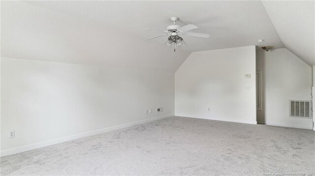 bonus room featuring ceiling fan, vaulted ceiling, and carpet floors