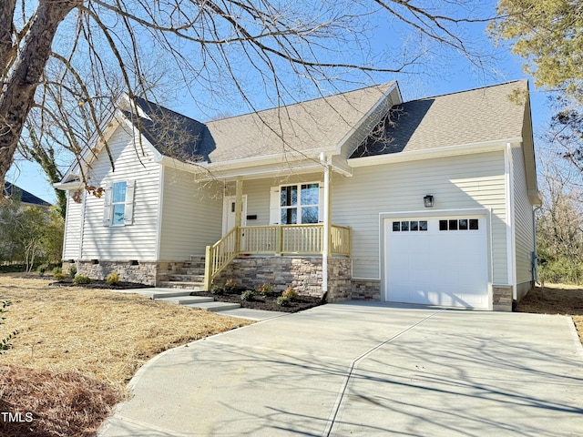 view of front of property featuring a garage and a porch