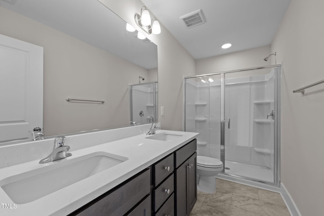 bathroom with vanity, toilet, and walk in shower