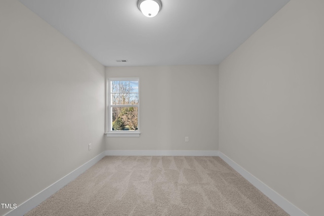 unfurnished room with light colored carpet