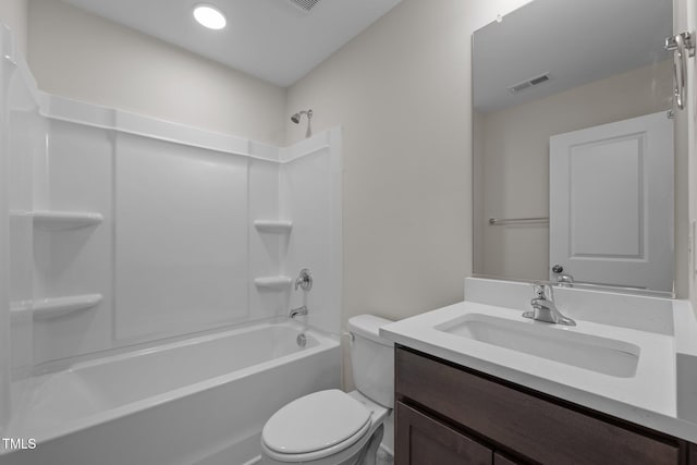 full bathroom with bathing tub / shower combination, vanity, and toilet