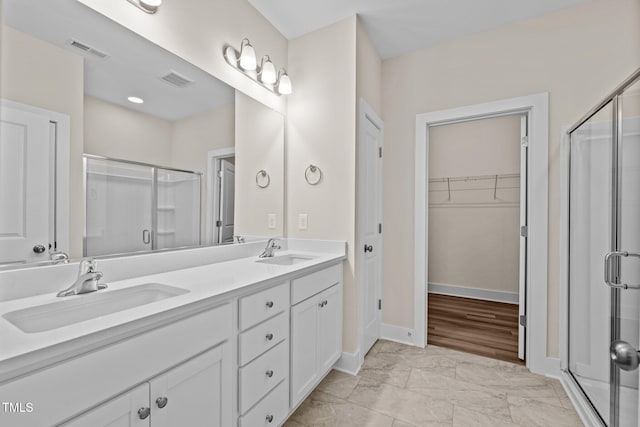 bathroom with vanity and walk in shower