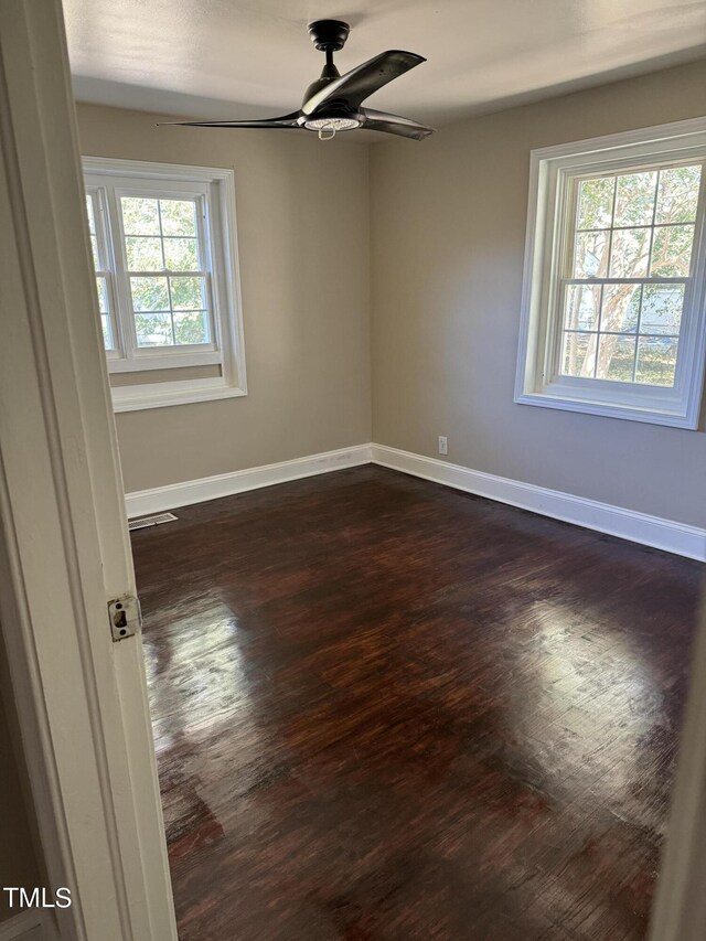 405 Whitfield Dr, Goldsboro, NC 27530 - empty room featuring dark wood-style floors, baseboards, and ceiling fan