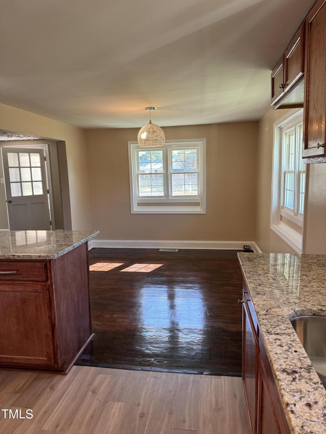 405 Whitfield Dr, Goldsboro, NC 27530 - unfurnished dining area featuring plenty of natural light, wood finished floors, and baseboards