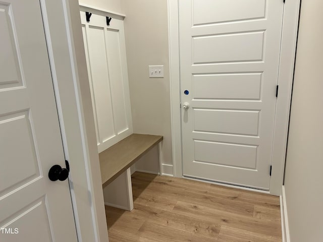 mudroom with light hardwood / wood-style floors