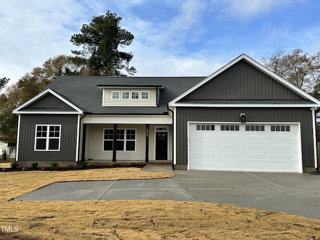 craftsman inspired home featuring a porch and a garage