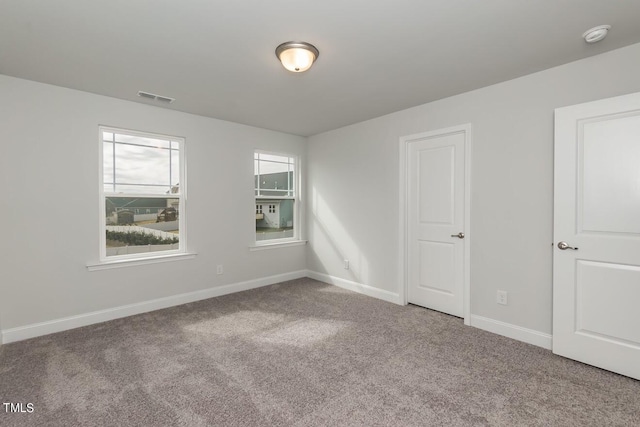 empty room with carpet flooring