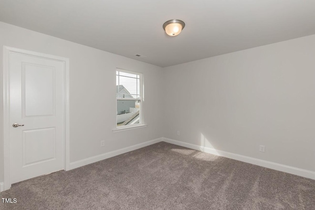 unfurnished room featuring carpet floors