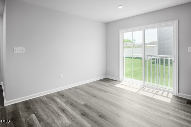 empty room with light hardwood / wood-style floors