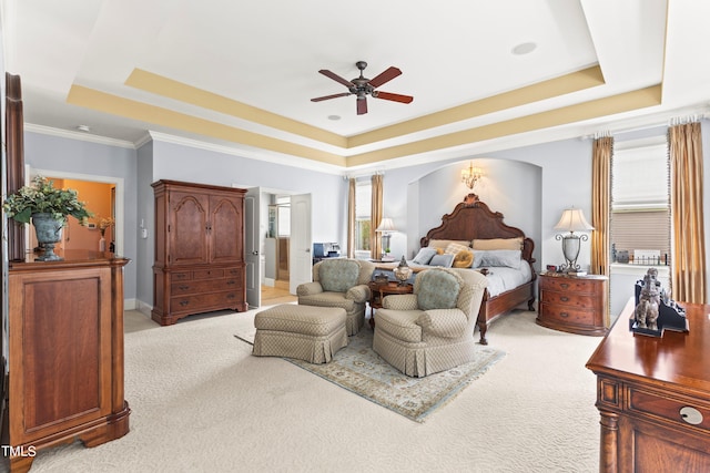 bedroom with light carpet, ceiling fan, crown molding, and a raised ceiling