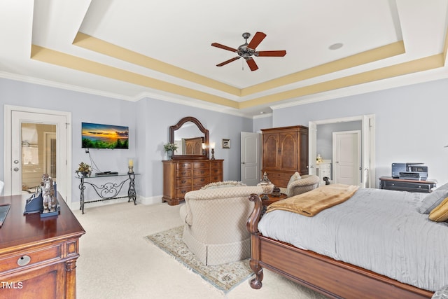 carpeted bedroom featuring crown molding, a raised ceiling, and ceiling fan