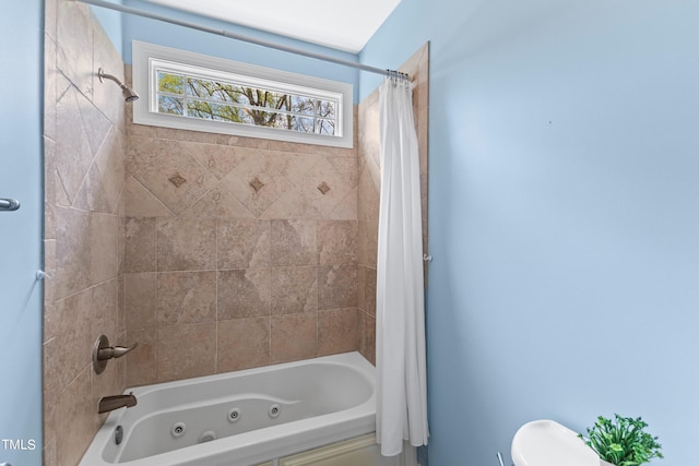 bathroom featuring toilet and shower / bathtub combination with curtain