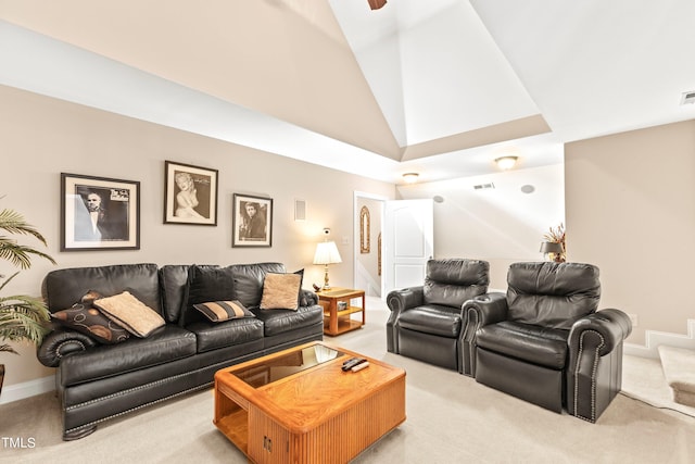 home theater room with light carpet and lofted ceiling