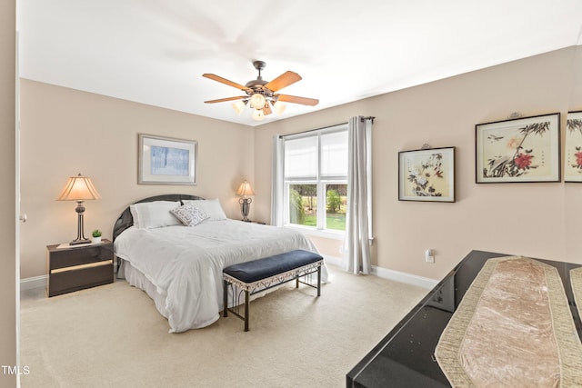 bedroom with light carpet and ceiling fan