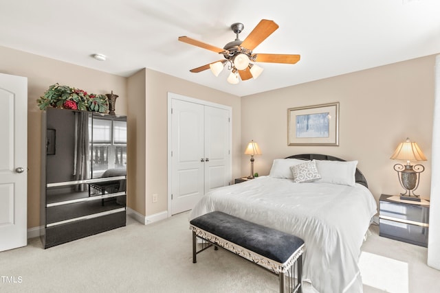 carpeted bedroom with a closet and ceiling fan