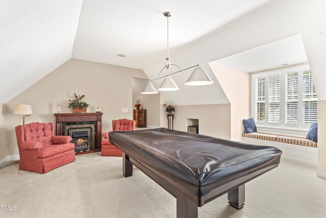 rec room with light carpet, billiards, and vaulted ceiling