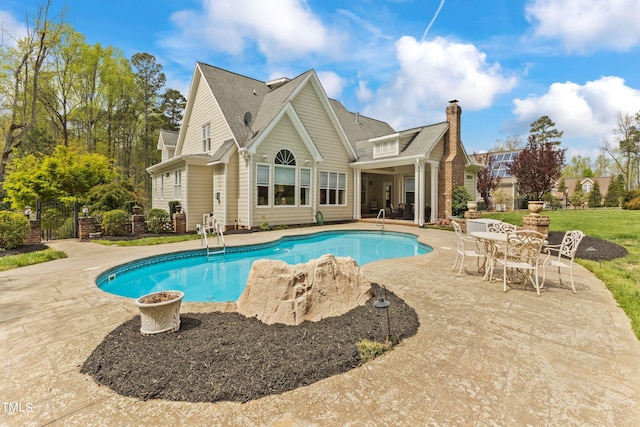 view of swimming pool with a patio