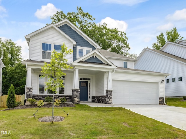 craftsman-style home featuring a front lawn and a garage