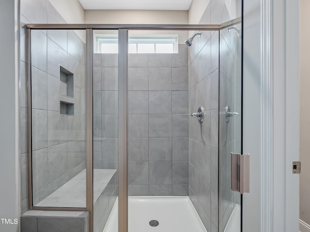 bathroom with an enclosed shower