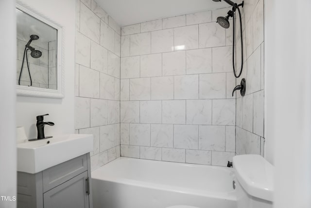 full bathroom with vanity, toilet, and tiled shower / bath