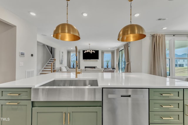 kitchen with open floor plan, green cabinets, dishwasher, and light countertops
