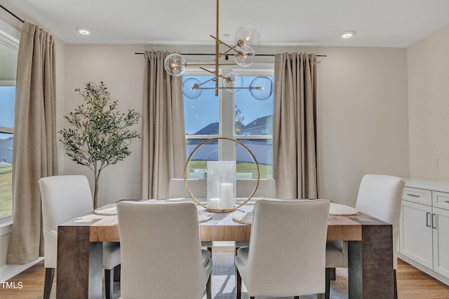 dining room with an inviting chandelier and light wood finished floors