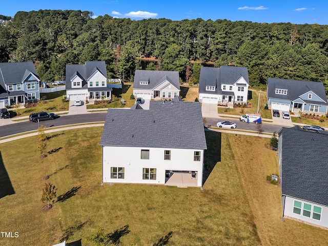 aerial view with a residential view and a view of trees