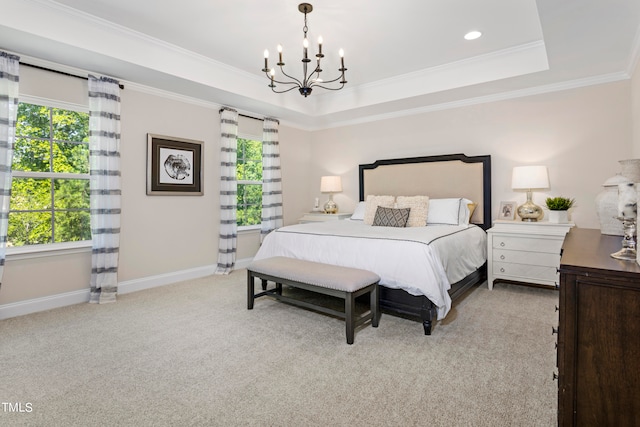 bedroom featuring ornamental molding, a chandelier, light carpet, and a tray ceiling