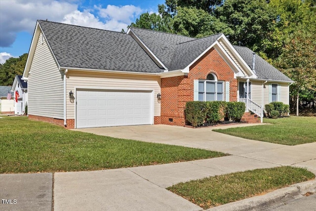 view of front of property featuring a front yard and a garage