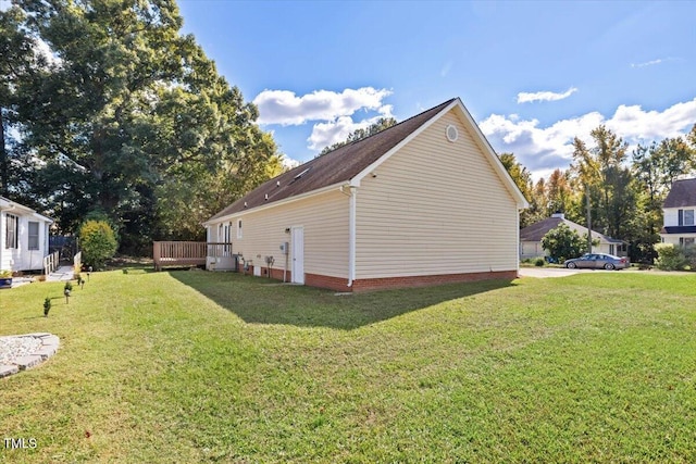 view of side of property with a yard