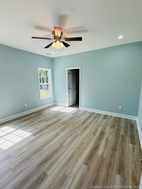 1361 7th St SE, Lumberton, NC 28358 - spare room featuring baseboards, wood finished floors, ceiling fan, and recessed lighting