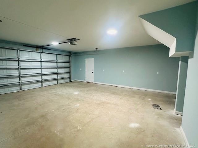 1361 7th St SE, Lumberton, NC 28358 - garage with baseboards and a garage door opener