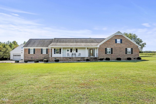 view of front of home featuring a porch, a front yard, and a garage