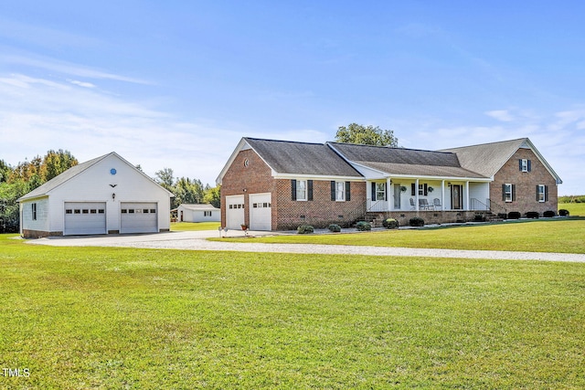 2554 Davis Mill Rd, Fremont, NC 27830 - view of front of house featuring a detached garage, covered porch, a front lawn, brick siding, and crawl space