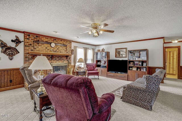 2554 Davis Mill Rd, Fremont, NC 27830 - living area featuring carpet floors, a ceiling fan, ornamental molding, a wainscoted wall, and a textured ceiling