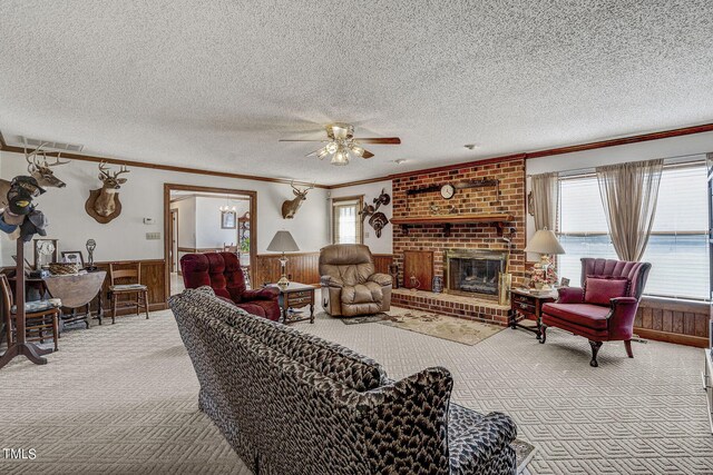 2554 Davis Mill Rd, Fremont, NC 27830 - carpeted living room with ornamental molding, healthy amount of natural light, a wainscoted wall, a ceiling fan, and a textured ceiling