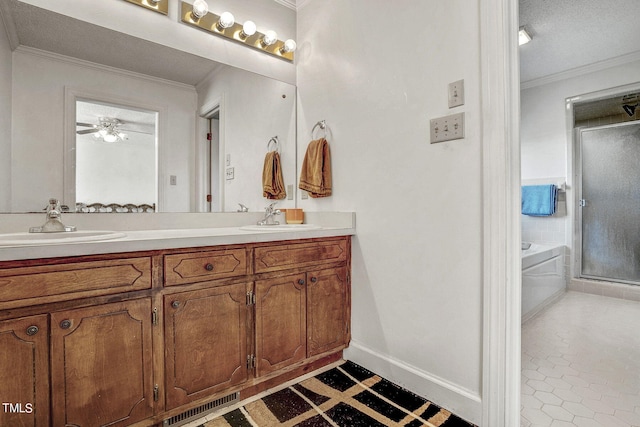 2554 Davis Mill Rd, Fremont, NC 27830 - bathroom featuring ornamental molding, double vanity, a shower stall, a garden tub, and baseboards