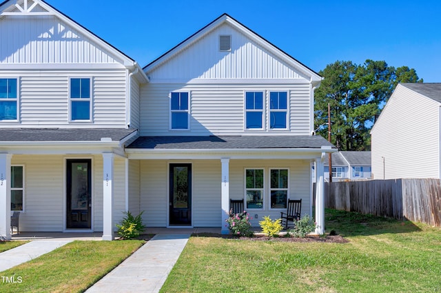 view of front of home featuring a front yard and a porch