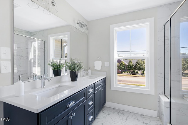 bathroom with vanity and a shower with shower door