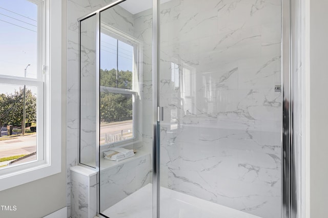 bathroom featuring plenty of natural light and an enclosed shower