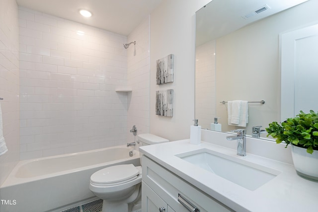 full bathroom with vanity, toilet, and tiled shower / bath