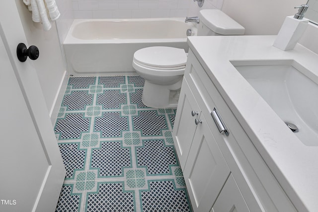 bathroom with vanity, a bathtub, toilet, and tile patterned flooring