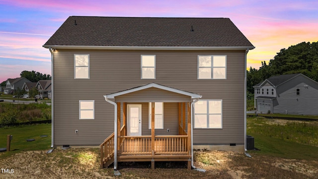 15 Diamond Creek Dr, Zebulon, NC 27597 - back of property at dusk featuring crawl space, a yard, and a porch