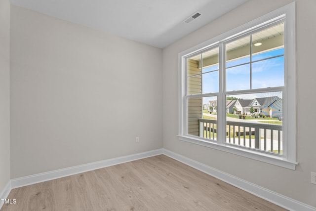 15 Diamond Creek Dr, Zebulon, NC 27597 - unfurnished room featuring light wood finished floors and a residential view