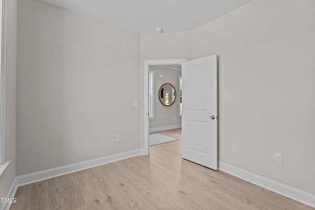 15 Diamond Creek Dr, Zebulon, NC 27597 - unfurnished room featuring light wood-type flooring and a smoke detector