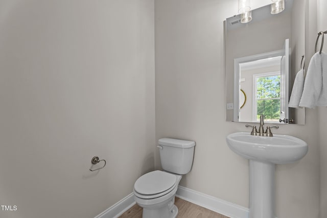 15 Diamond Creek Dr, Zebulon, NC 27597 - half bathroom featuring wood finished floors and toilet
